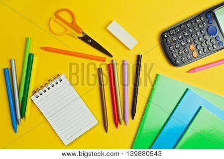 School suplies on yellow background. Back to school concept