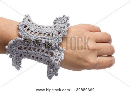 Knitted handmade blue bracelet isolated on white background