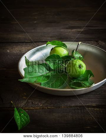 Fresh Green Apples With Leaves On Dark Rusric Background.