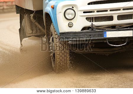 Sweeper Cleans Dirt Road