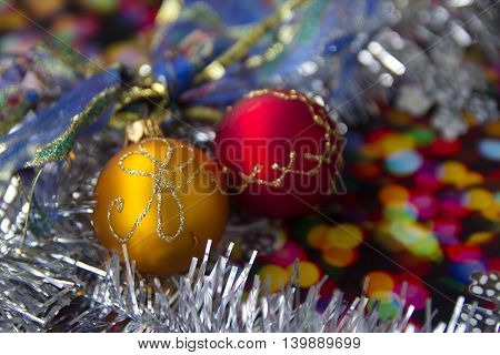 bright Christmas balls with reflections and colored tinsel