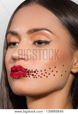 beauty woman face with creative make up red lips roses
