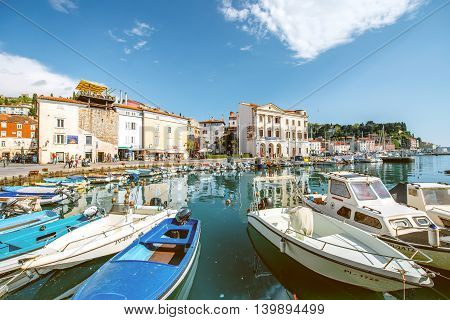 Piran, Slovenia - May 7, 2016: View on marina with fishing boats in Piran old town. Piran is one of Slovenia's major tourist attractions.
