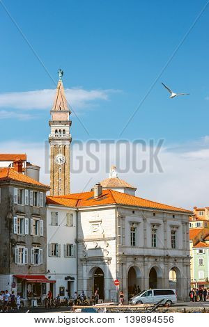 Piran, Slovenia - May 7, 2016: Piran old town center with church tower and old buildings. Piran is one of Slovenia's major tourist attractions.