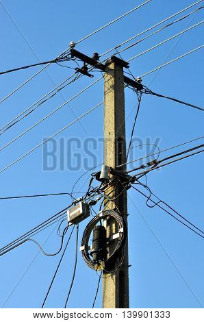 LED street lighting and power lines with blue sky background