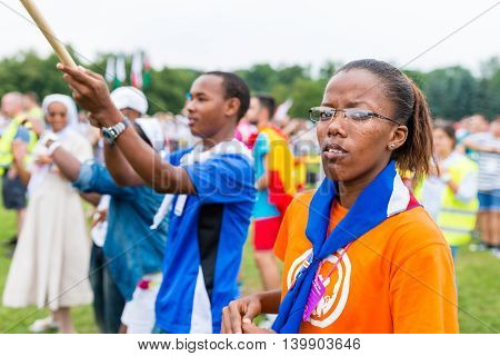 Poznan POLAND - JULY 24 2016: pilgrims praying dancing and singing during Days In Dioceses just before The World Youth Day in Krakow; WYD is a meeting of youth from all over the world