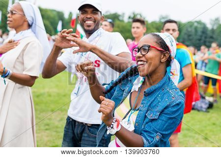 Poznan POLAND - JULY 24 2016: pilgrims praying dancing and singing during Days In Dioceses just before The World Youth Day in Krakow; WYD is a meeting of youth from all over the world