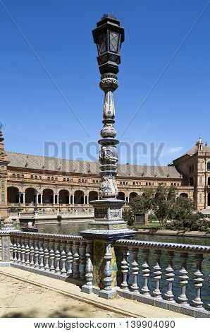 Detail of the ceramic tiled balustrade and lamp pole at the Plaza de Espana (Spain Square) in Seville Spain