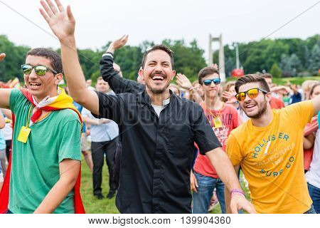 Poznan POLAND - JULY 24 2016: pilgrims praying dancing and singing during Days In Dioceses just before The World Youth Day in Krakow; WYD is a meeting of youth from all over the world