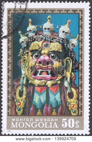 MOSCOW RUSSIA - CIRCA FEBRUARY 2016: a post stamp printed in MONGOLIA shows a traditional Mongol mask the series 