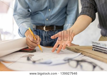 business architect drawing on blueprint architectural concept soft focus