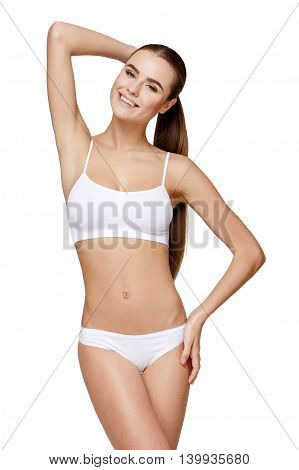 Sexy young girl in white lingerie on a white background