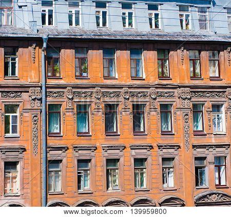 The windows of the old house on Pushkin Street in St. Petersburg.
