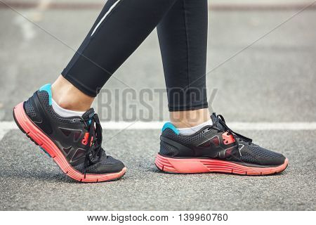 Close Up Of Running Shoes On Road.