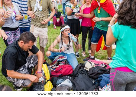 Poznan POLAND - JULY 24 2016: pilgrims resting during Days In Dioceses just before The World Youth Day in Krakow; WYD is an international meeting of youth from all over the world