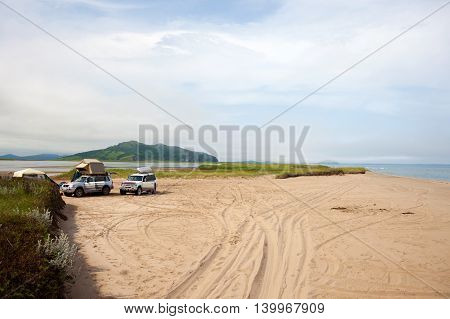KHASAN RUSSIA - JULY 23 2015: Automobile camp on sandy beach