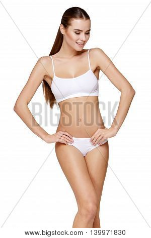 Sexy young girl in white lingerie on a white background