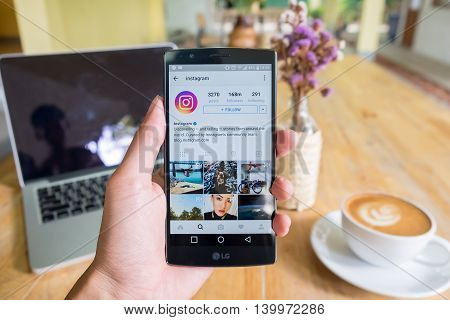 CHIANG MAI THAILAND - JUN 19 2016: A man hand holding lg g4 with instagram application. Instagram is largest and most popular photograph social networking.