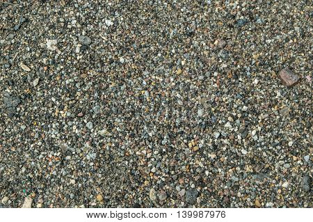 Small hoggin stones texture top view close shot abstract background