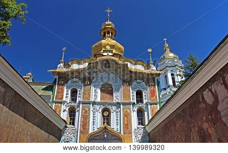 Entrance to Kiev-Pechersk Lavra monastery from Mazepa street. The walls are decorated with rich carvings and paintings, Kyiv, Ukraine