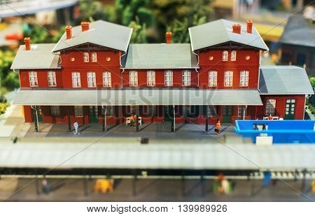 City In Miniature. Model Of Railstation With Passengers.