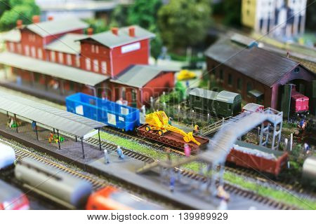 City In Miniature. Model Of Train On Rail Station.