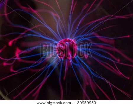 Plasma ball in action over dark background