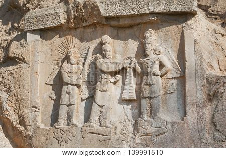 Persian kings on stone relief of the monument Taq-e Bostan in Iran. Taq-e Bostan is rock relief from 4 century era of Sassanid Empire of Persia