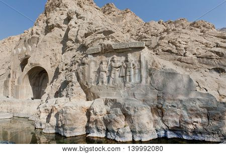 Lake around the ancient relief in Kermanshah - Crowning ceremony of Ardashir II. Stone monument Taq-e Bostan in Iran. Taq-e Bostan is rock relief from 4 century era of Sassanid Empire of Persia