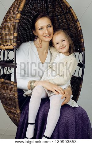 young mother with daughter at luxury home interior vintage, old fashion relashionship family