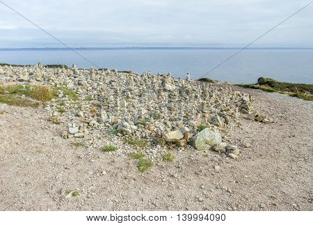 coastal scenery with lots of small stacked stone piles at the Crozon peninsula in Brittany France