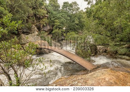 A Pedestrian Bridge On The Trail To The Cascades In The Mahai River In The Kwazulu-natal Drakensberg