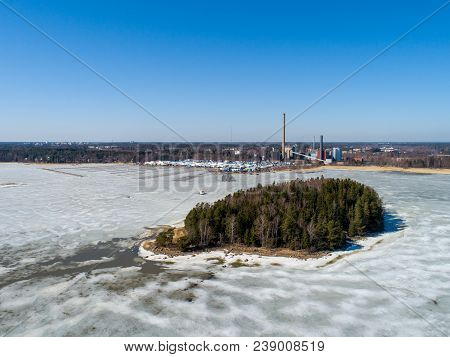 Finland Espoo, Suomenoja Marina With The Boats Still On Land At Winter Storage, Power Plant In The B