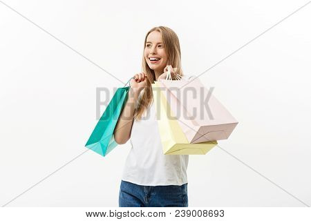 Shopping And Lifestyle Concept: Young Happy Summer Shopping Woman Smiling And Holding Shopping Bags 