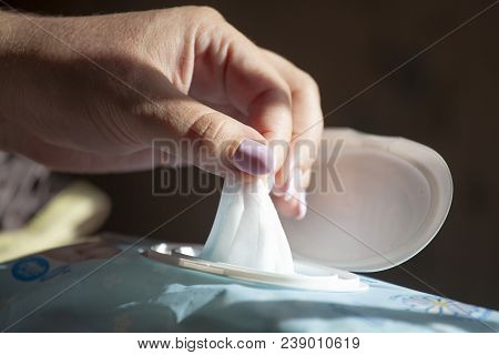 Wet Wipes In A Woman's Hand - Hand Picked A Wet Wipes In Package Box