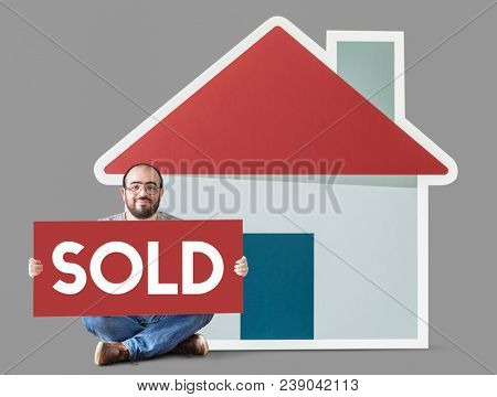 Man holding poster with house mockup