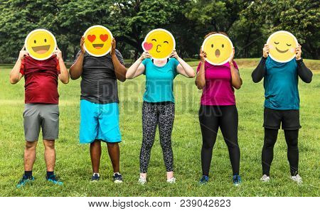 Group of diverse people with emoticon