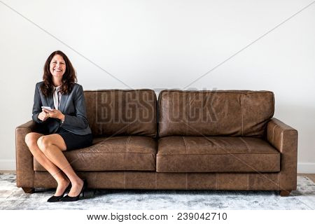 Businesswoman sitting alone on the couch
