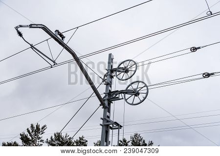 Catenary Wires For Power Supply To Railway Against Sky.