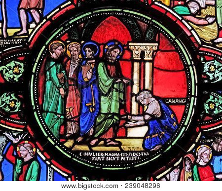 PARIS, FRANCE - JANUARY 09: Jesus and the Canaanite woman, stained glass window from Saint Germain-l'Auxerrois church in Paris, France on January 09, 2018.