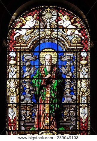 PARIS, FRANCE - JANUARY 09: Saint Dionysius the Areopagite, stained glass windows in the Saint Roch Church, Paris, France on January 09, 2018.