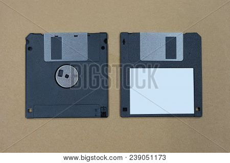 Black Floppy Disk Or Diskette On Brown Background