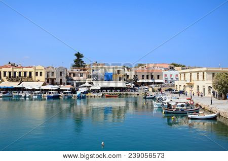 Rethymno, Greece - September 15, 2016 - View Of Fishing Boats And Waterfront Restaurants In The Inne