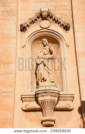 Religious Statue On The Front Of Naxxar Parish Church, Naxxar, Malta, Europe.
