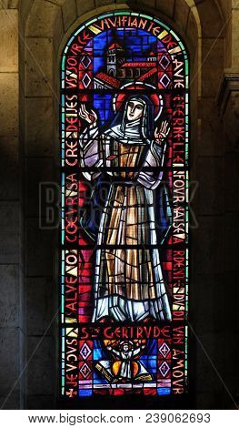 PARIS, FRANCE - JANUARY 08, 2018: Saint Gertrude the Great or Saint Gertrude of Helfta, stained glass window in Basilica of the Sacre Coeur, dedicated to the Sacred Heart of Jesus in Paris, France.