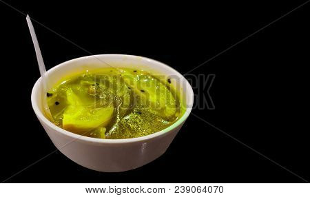 Kaccha Aam Chutney Sweet N Sour Unripe Green Mango Pickle On A China Clay Bowl On An Isolated Black 