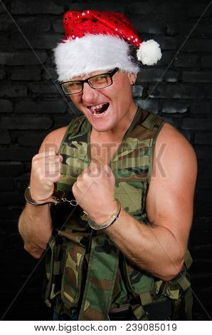 Angry Santa Claus. Handcuffs And Arrest. Angry Santa Claus.