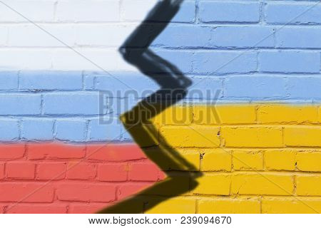 Ukraine And Russia Flag On Grunge Brick Wall