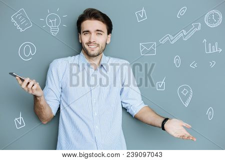 Positive Blogger. Cheerful Popular Blogger Feeling Surprised After Reading New Messages In His Smart