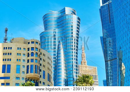 Close-up View Of Modern Constructions In Doha - Glass Skyscrapers Of Al Dafna District Reflect Neigh